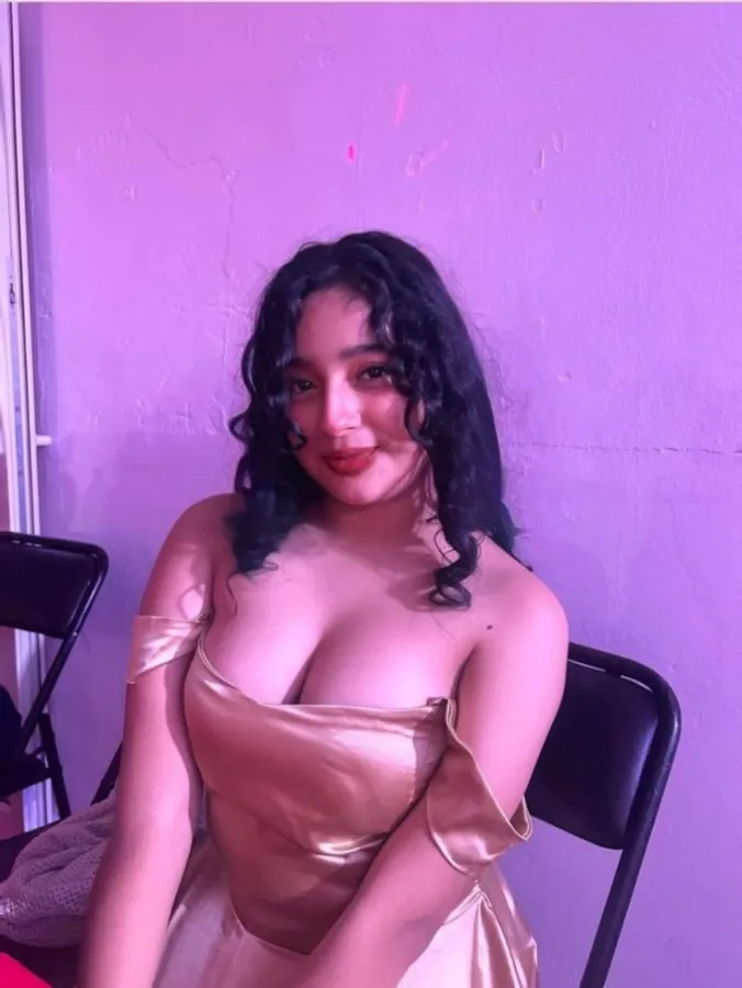 Attractive call girls in Mumbai posing in a chic lounge setting