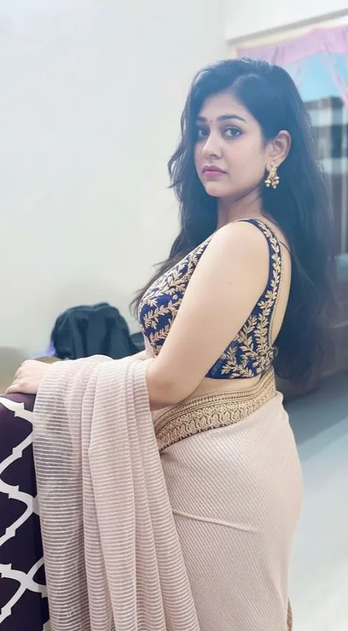 Discreet escort in Mumbai posing for a professional profile photo