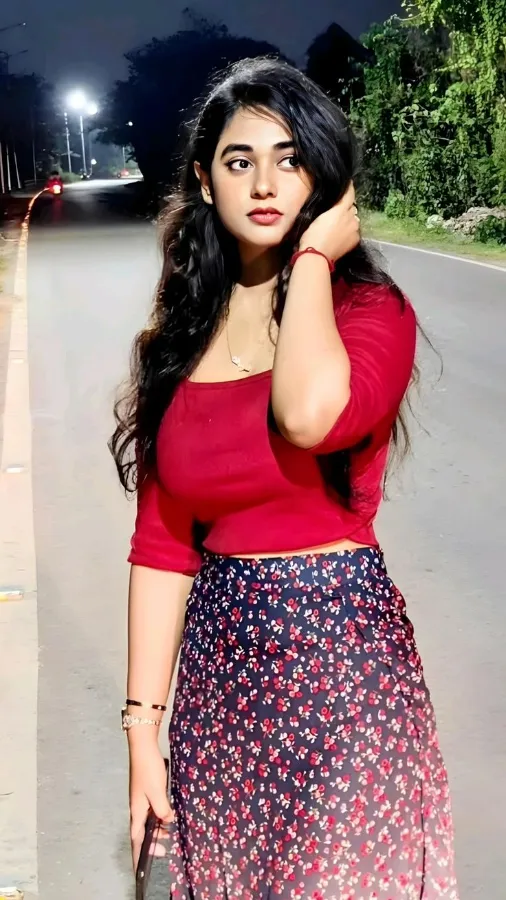 Friendly escort in Mumbai smiling directly at the camera