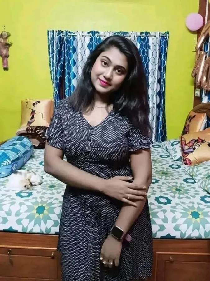 Elegant Mumbai escort service model wearing a red cocktail dress